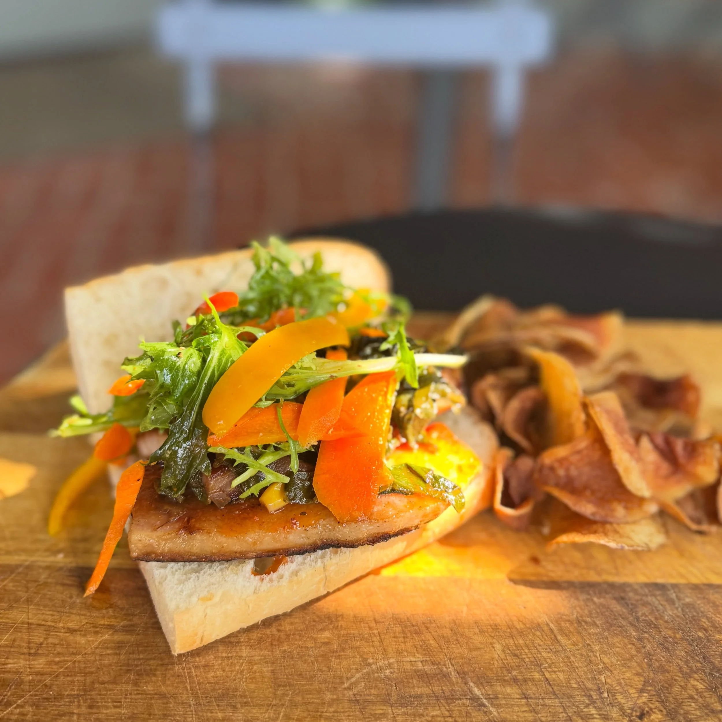 Skip your sad desk lunch and stop by for this sammie packed with fresh, bold flavors. 🔥

Thai My Belly Up - Sweet potato caramel Thai chili glazed pork belly piled onto Leidenheimer French bread with smoked miso braised collard greens, fris&eacute;e