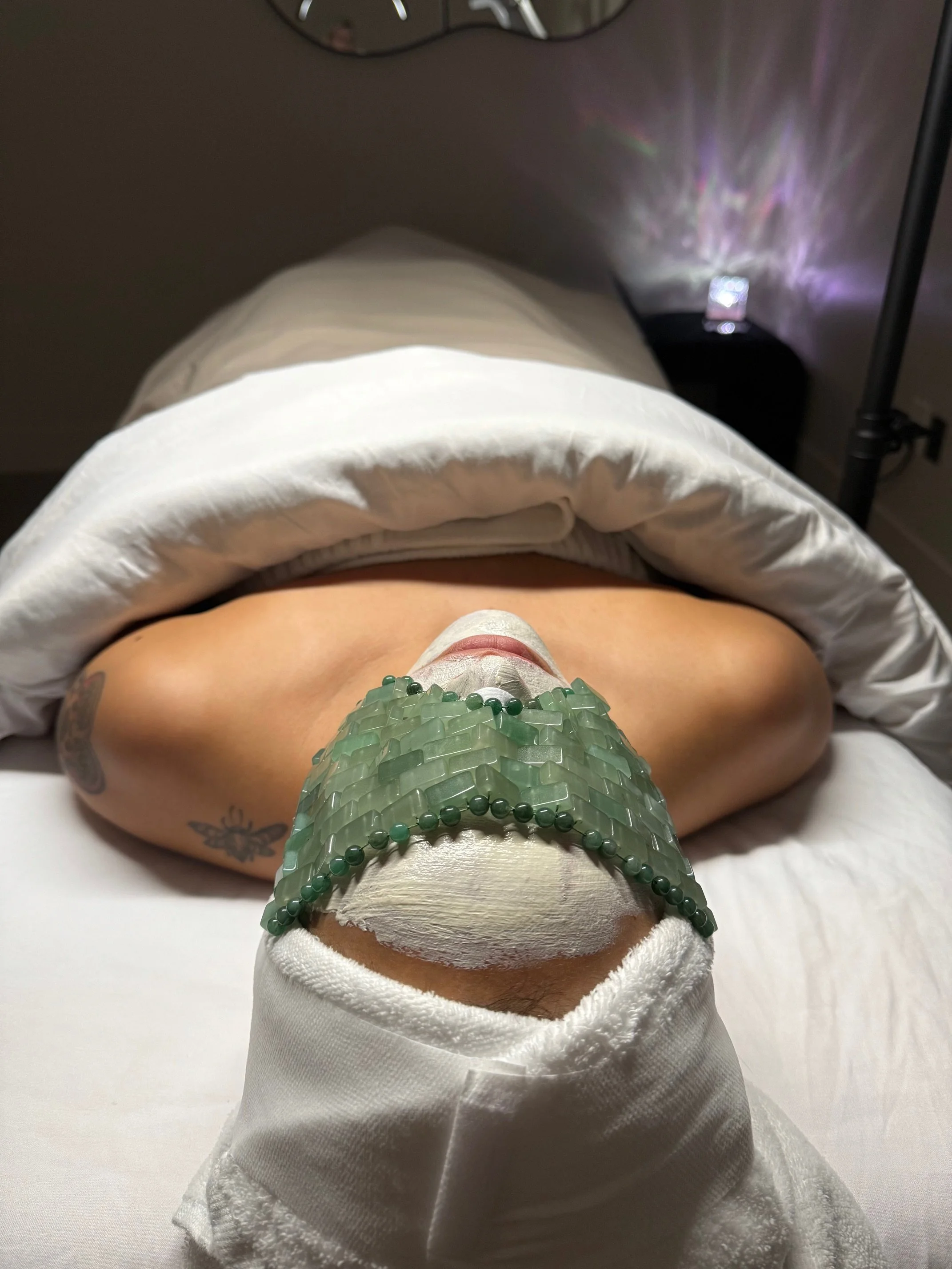 a woman having a face facial