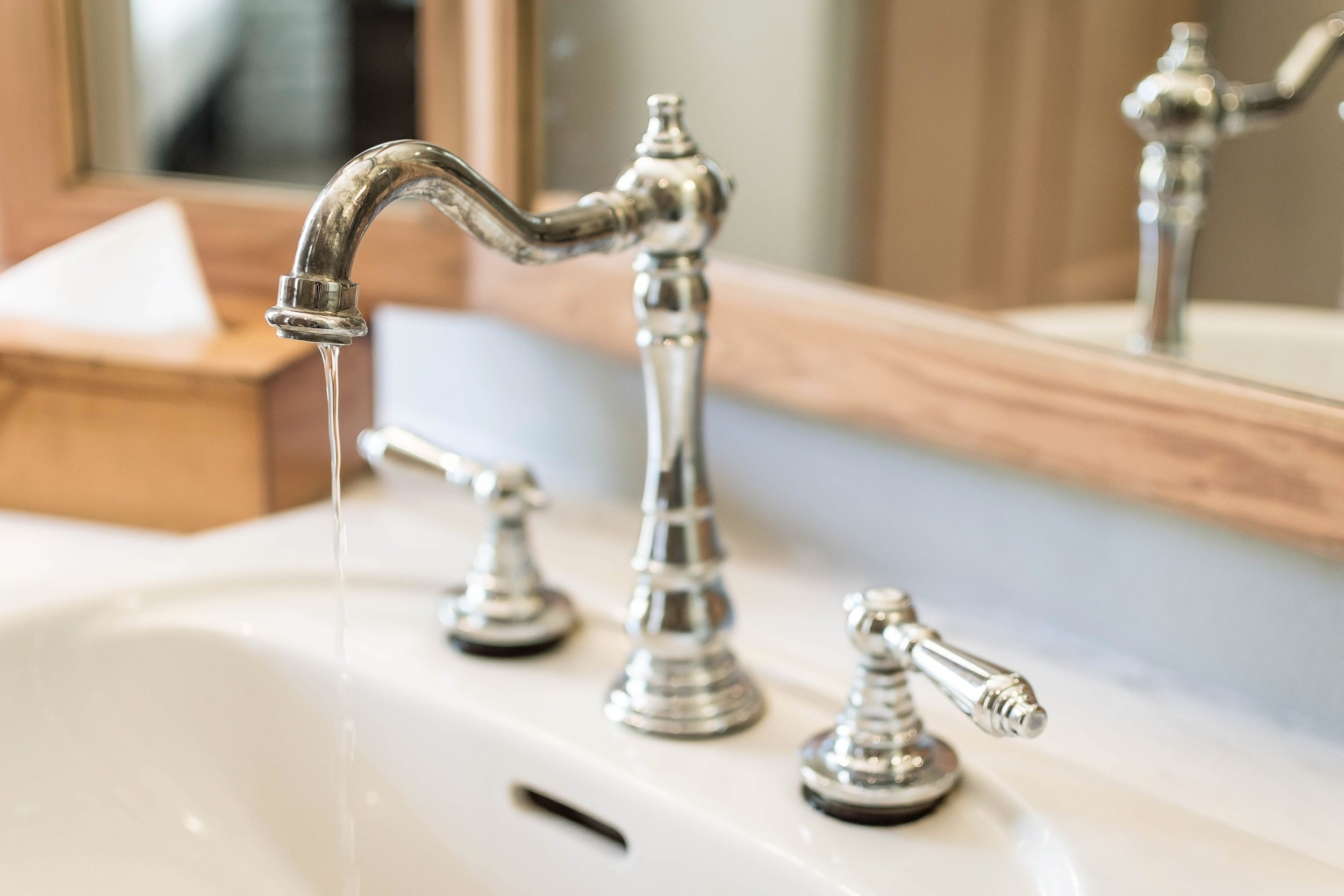 Water leaking from a sink drain pipe inside an apartment unit