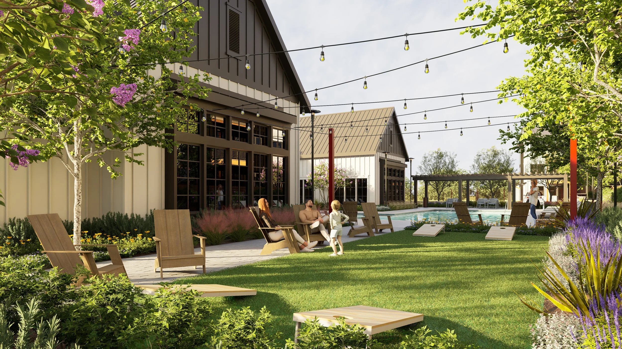 People relaxing outdoors near a pool with lounge chairs, surrounded by trees and flowering plants, in front of a modern building with string lights overhead.