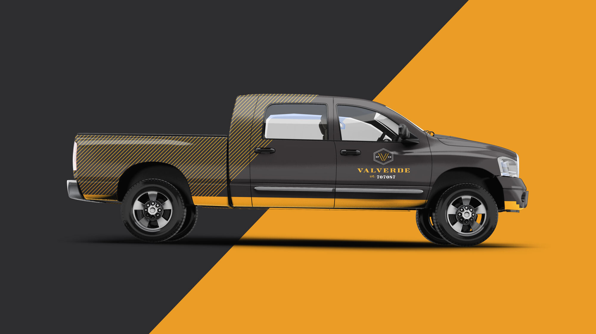 A four-door pickup truck with Valverde Construction branding on the side of the passenger door
