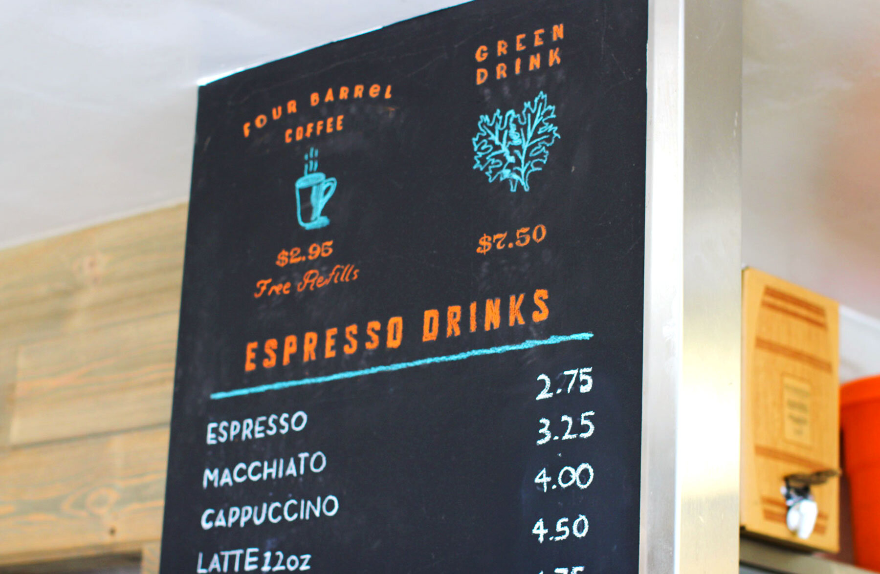 The menu on a chalkboard for Shoreline Coffee Shop with items and prices