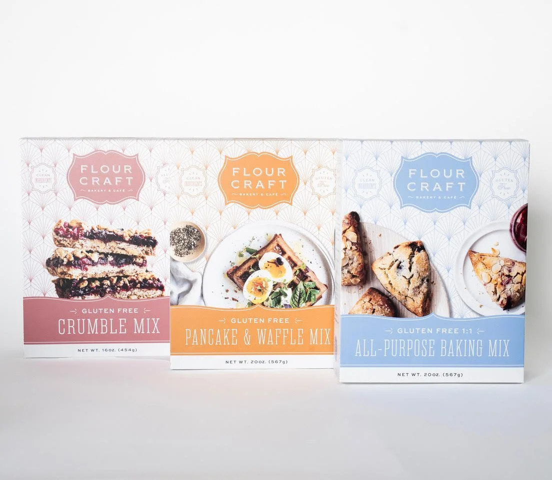 Three boxes of gluten-free baking mixes from Flour Craft, featuring crumbles, pancake and waffle, and all-purpose recipes.