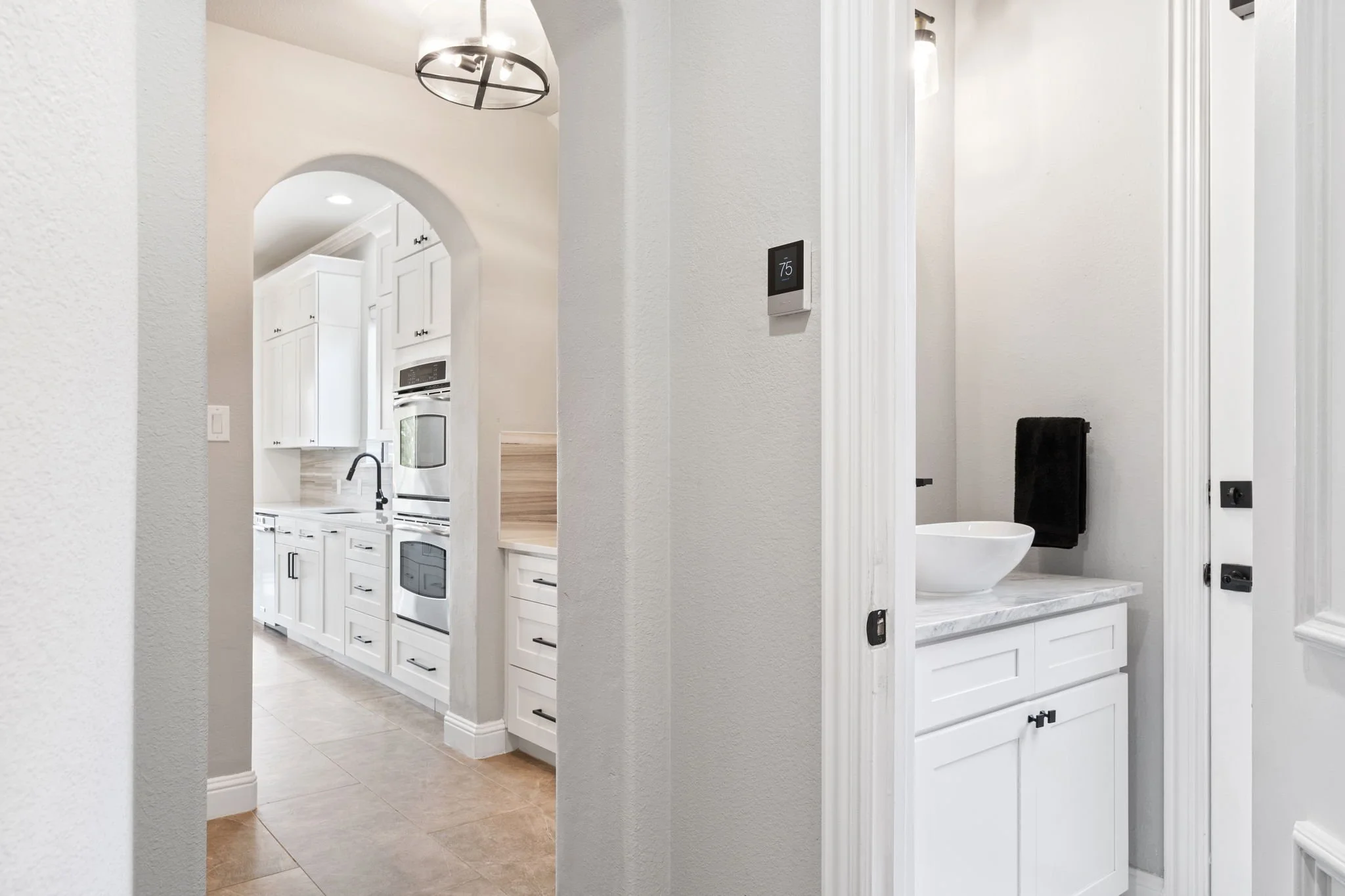 57-web-or-mls-2340ladycornwall-68-hallway-bath-entry.jpg