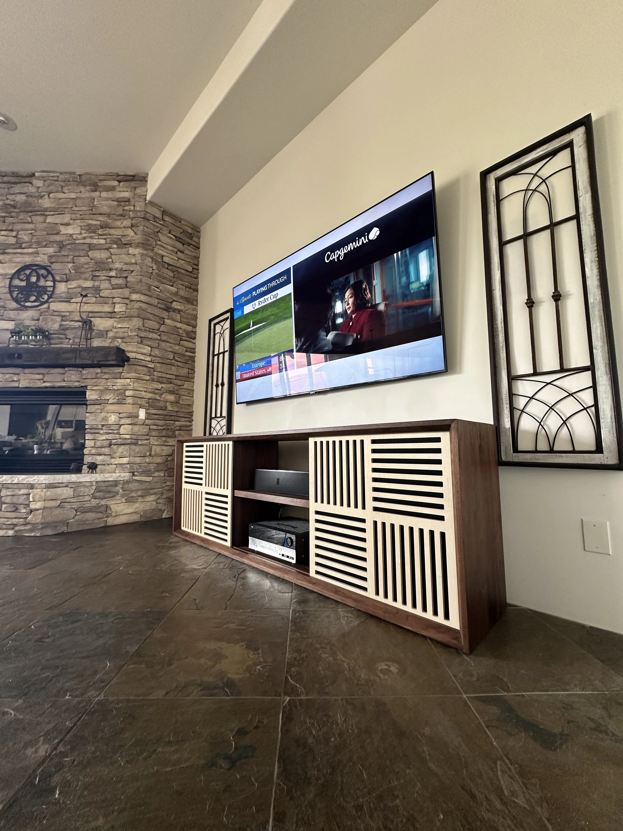 Custom Walnut media credenza with maple sliding doors
