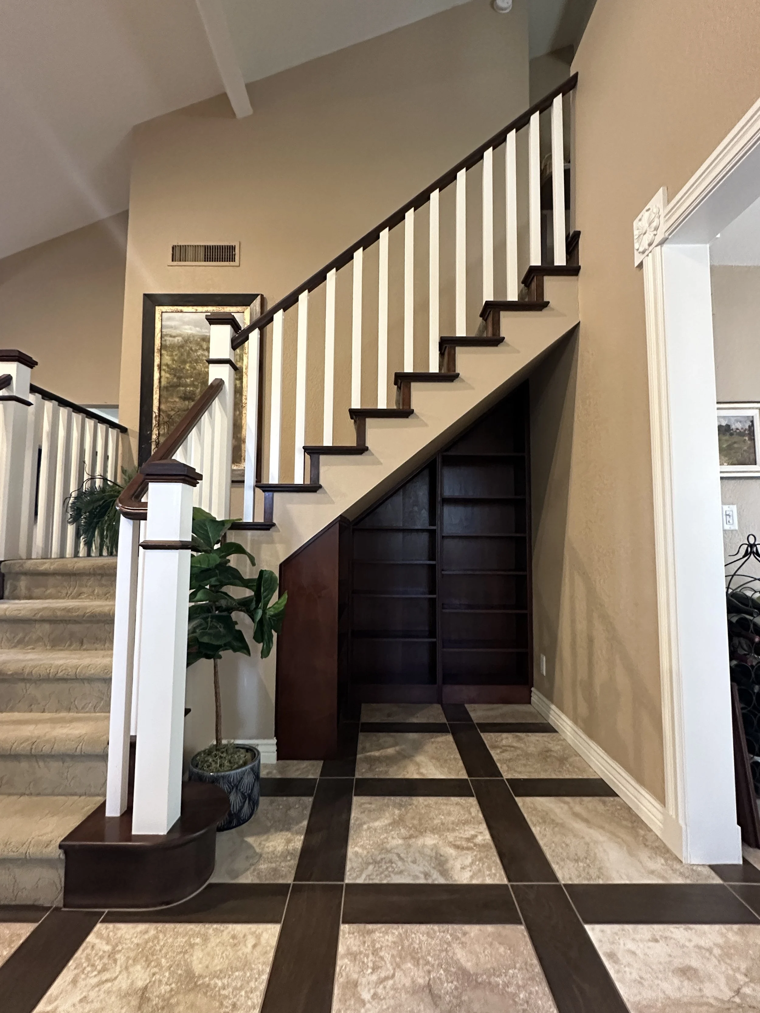 handmade bookcase, alder wood. constructed to fit perfectly in stair case nook