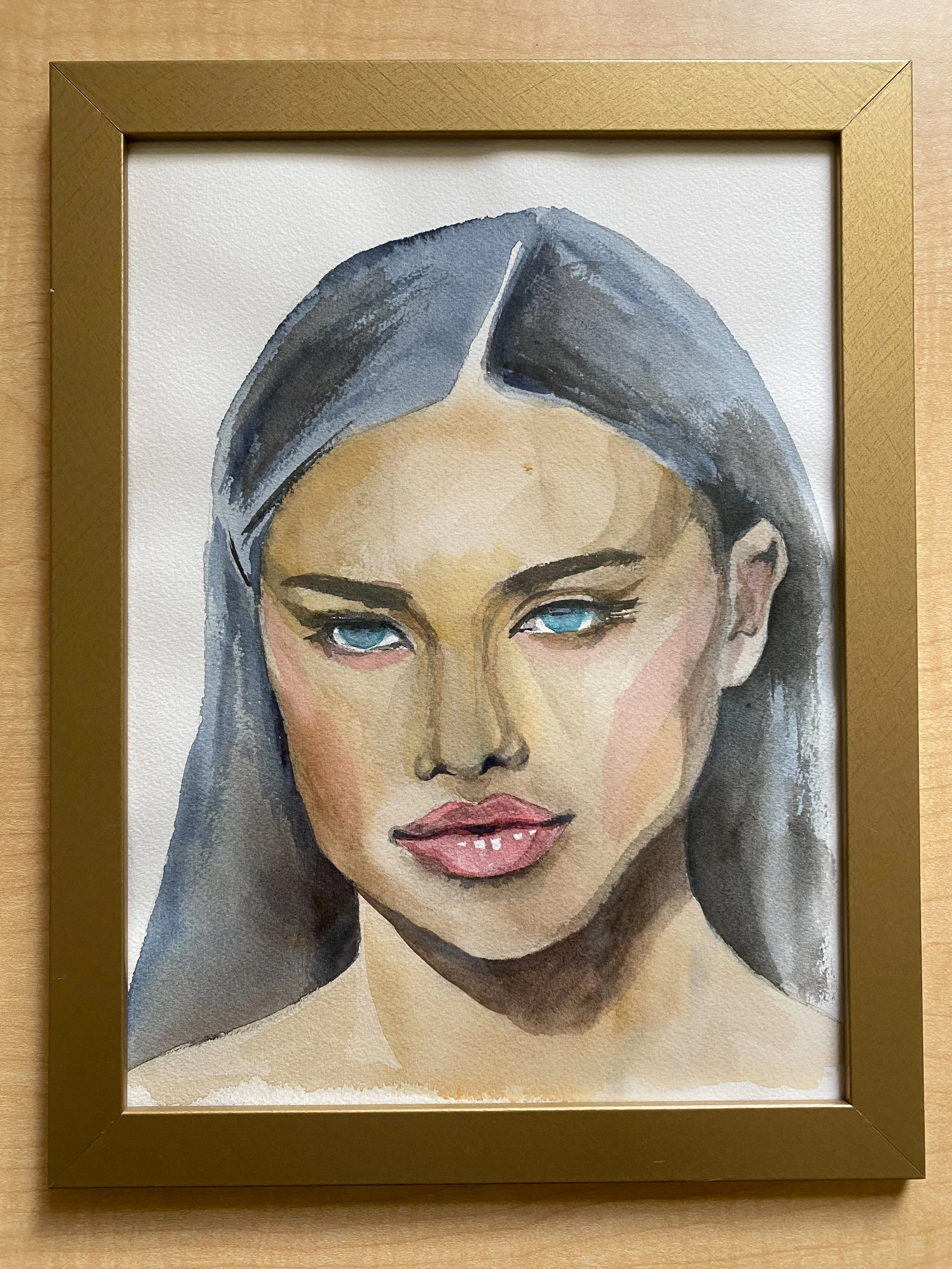 A watercolor painting of a woman with grey hair and blue eyes.