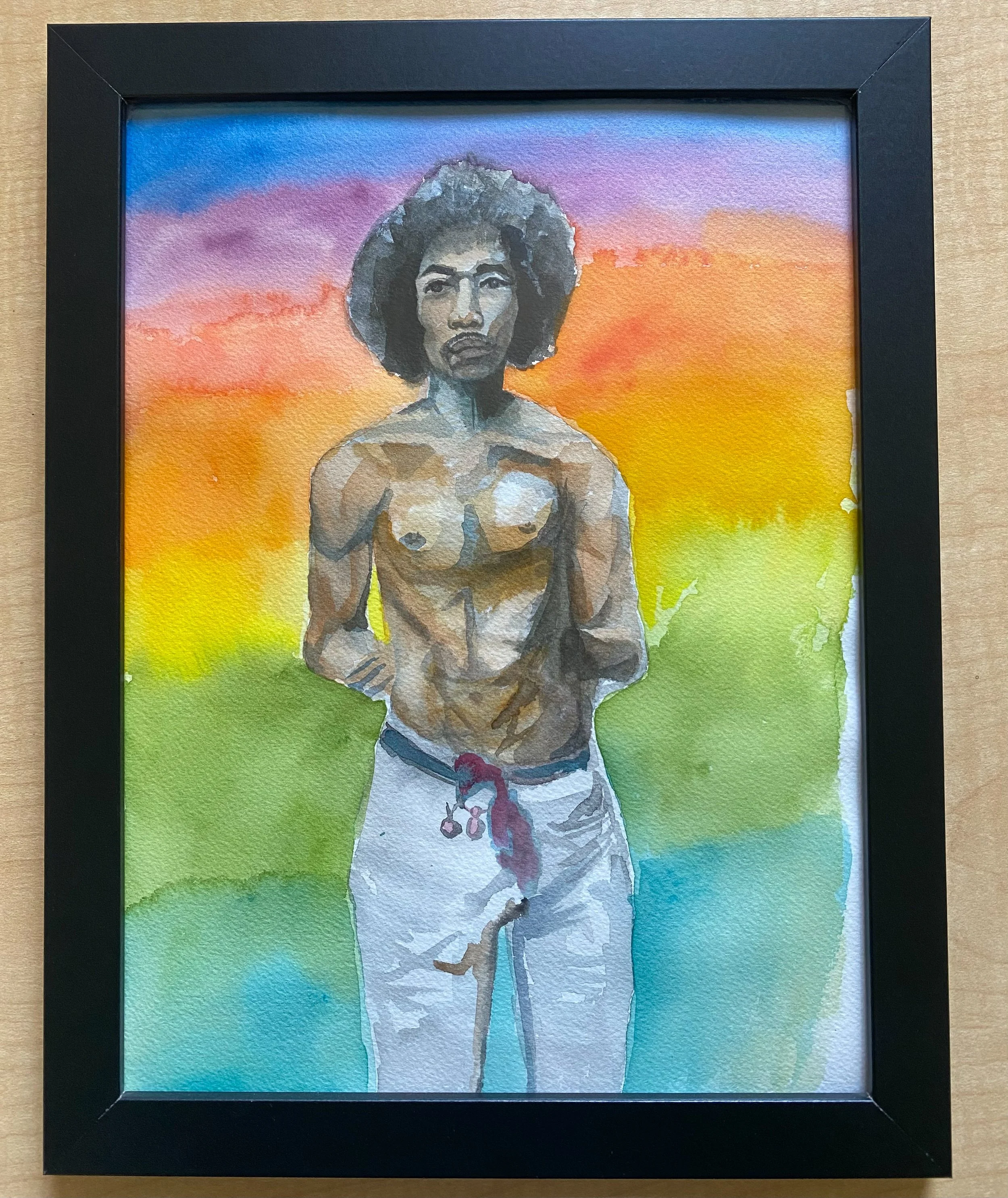 Watercolor painting of a young Black man with an afro, shirtless and wearing white pants with a red drawstring, standing against a colorful background with shades of purple, pink, orange, yellow, green, and blue.