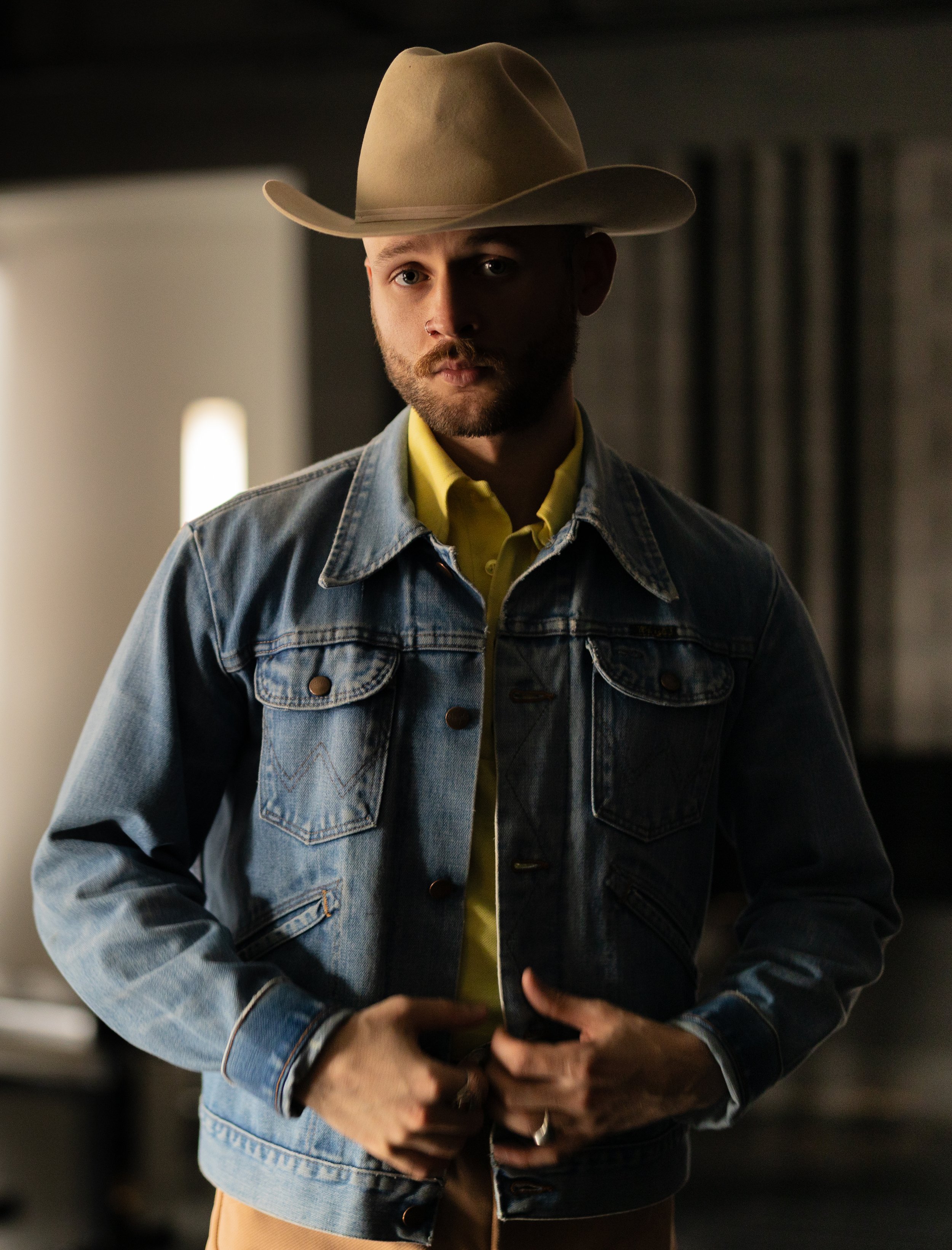 Air Force veteran Austin Simmons in a cowboy hat and denim jacket