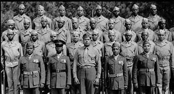 Historic black and white group portrait of a Montford Point Marines platoon in uniform
