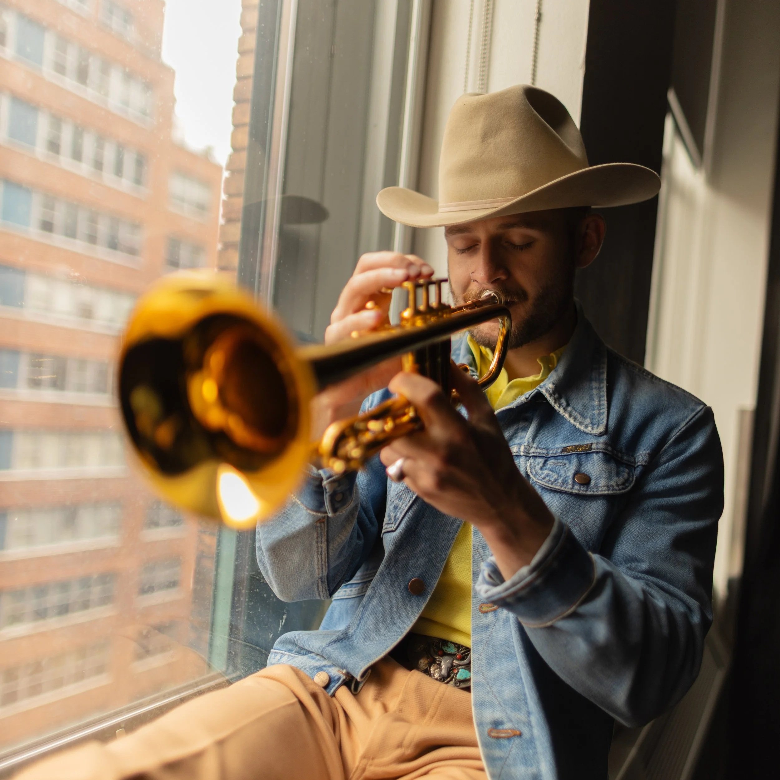 A New School Veteran student playing the trumpet