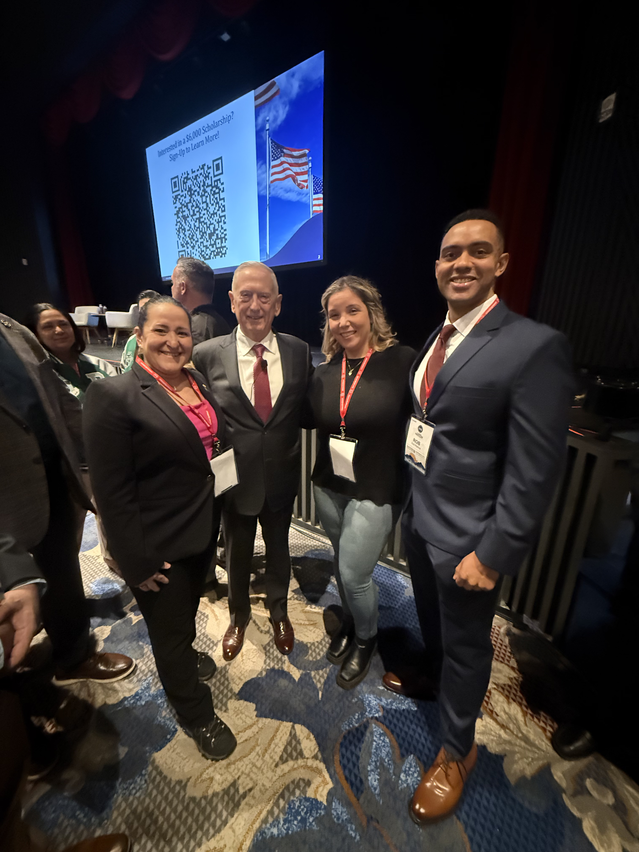 New School student veterans and staff posing for a group photo with a guest speaker at the Student Veterans of America NatCon