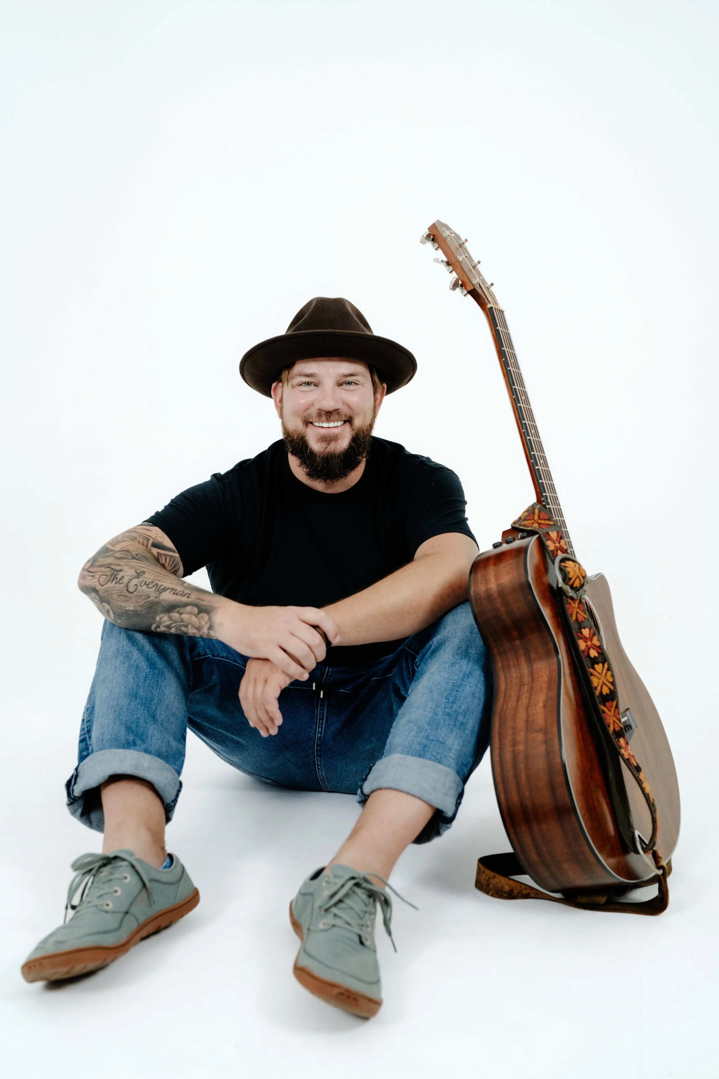 Colin Roberts Sitting with Guitar