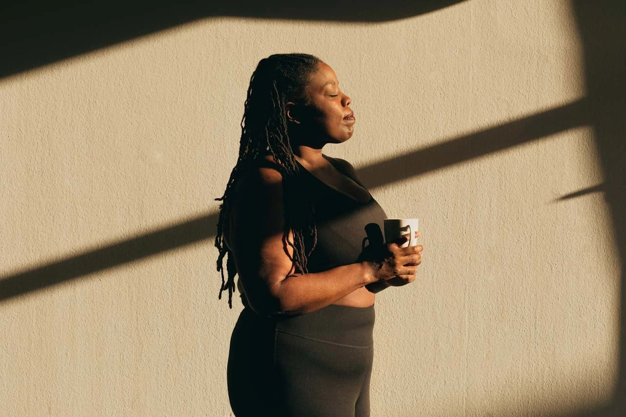 Woman enjoying a quiet moment, representing personalized reproductive healthcare and whole-person wellness at Maryam Reproductive Health.