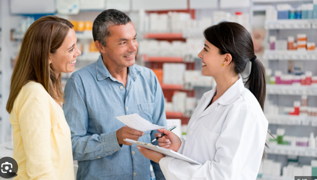 Pharmacist consulting with customers at Thrive Pharmacy in La Crescenta