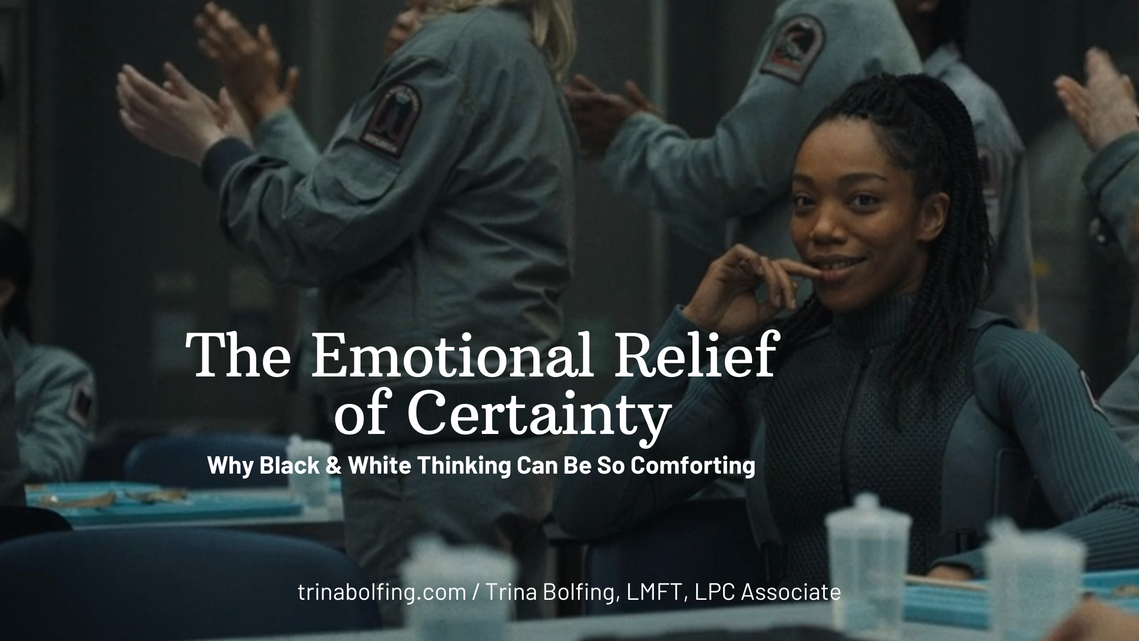 Still from Mickey 17 showing people in the background clapping with a woman on the right in the foreground seated with text the emotinoal relief of certainty why black & white thinking can feel so comforting