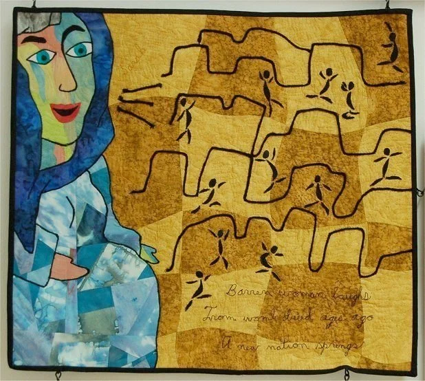 A quilt with a depiction of the Virgin Mary holding a child on the left side and a map on the right side, with a handwritten poem