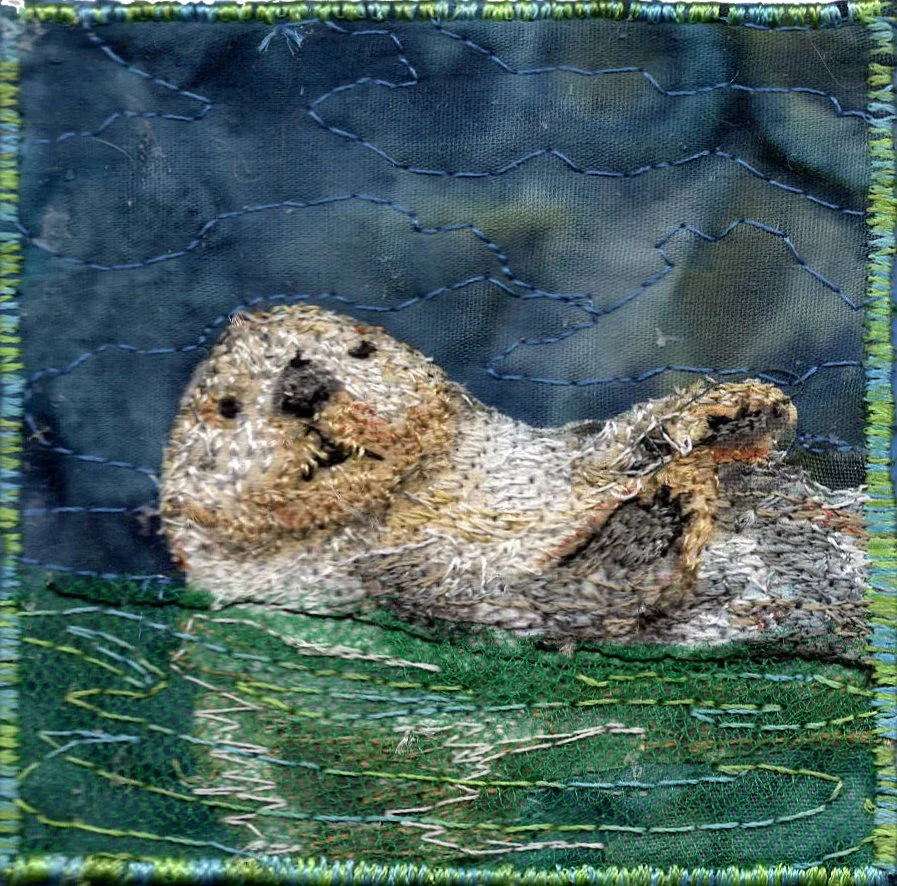 Otter floating on back