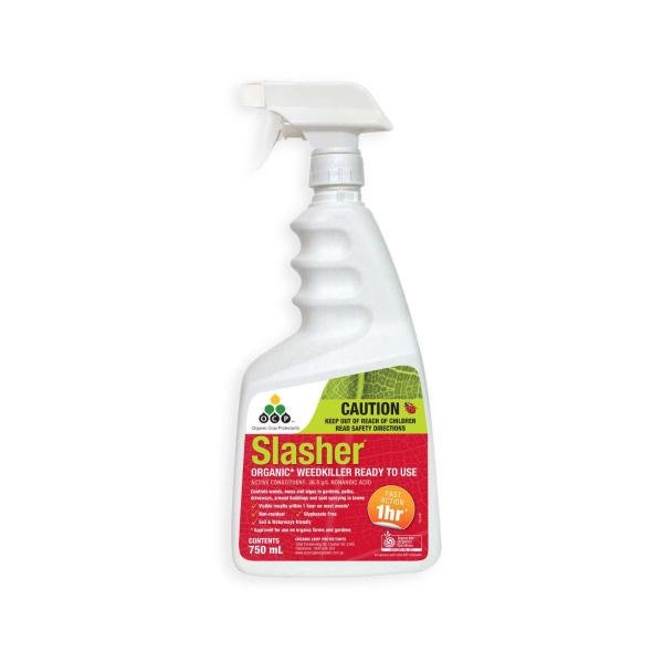 A white spray bottle of Slasher organic weedkiller with a red label and green caution strip.