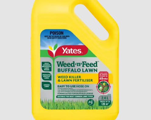 Yellow container of Yates Weed 'n Feed Buffalo Lawn fertilizer with a poison warning label and a handle at the top.