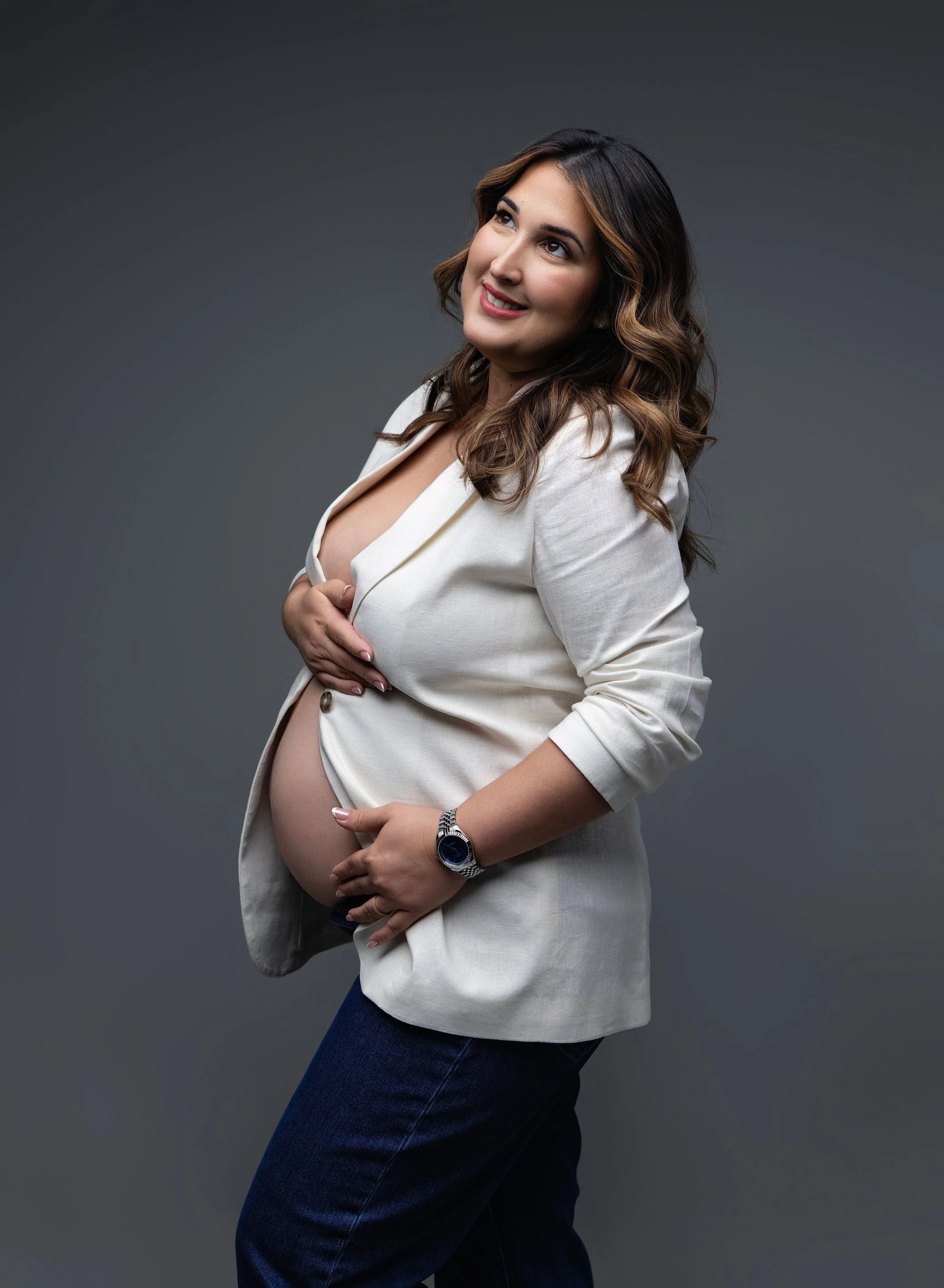 Pregnant mom in blazer and jeans for maternity session Port Charlotte studio