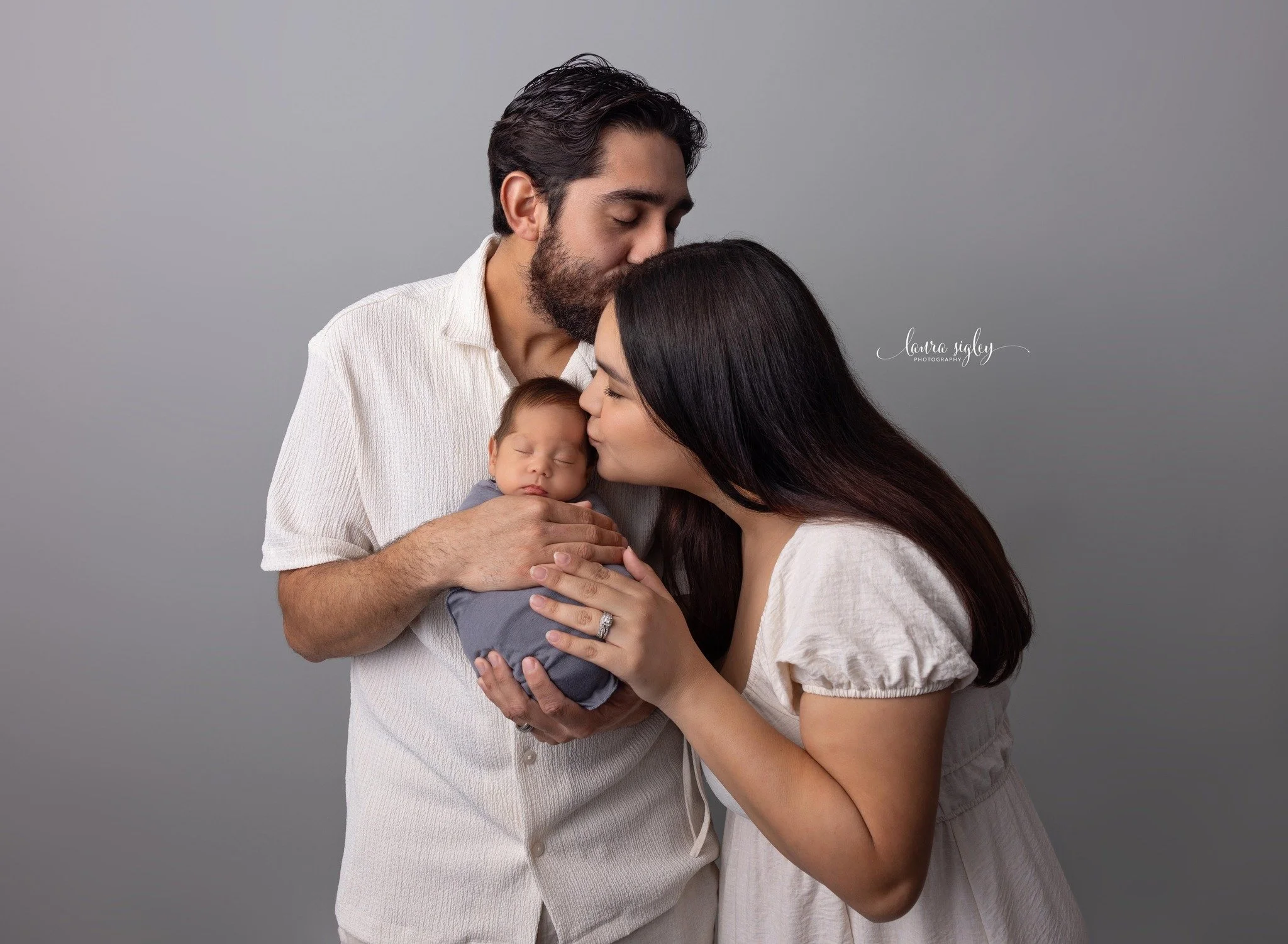 This beautiful mom and dad brought their first baby into the studio, and having Grandma join the session made it unforgettable. The way she looked at her grandchild was enough to melt anyone&rsquo;s heart.

Three generations in one moment.
One tiny b