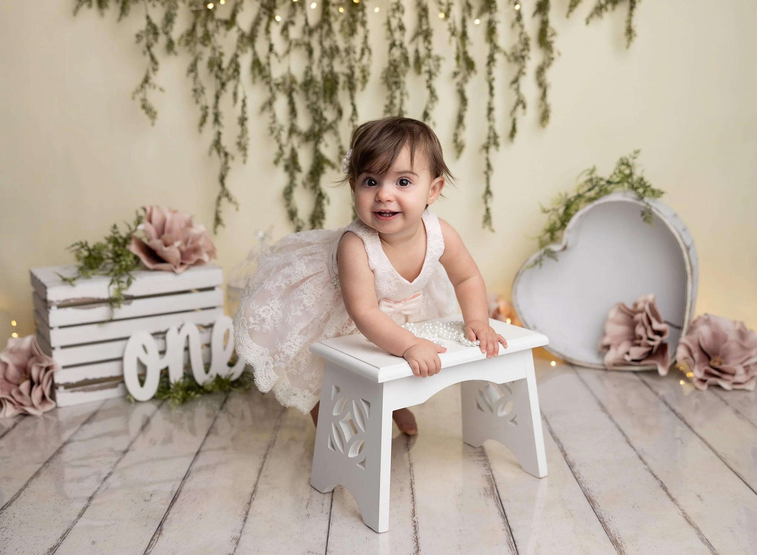 First birthday cake smash with floral backdrop in North Port FL photo studio