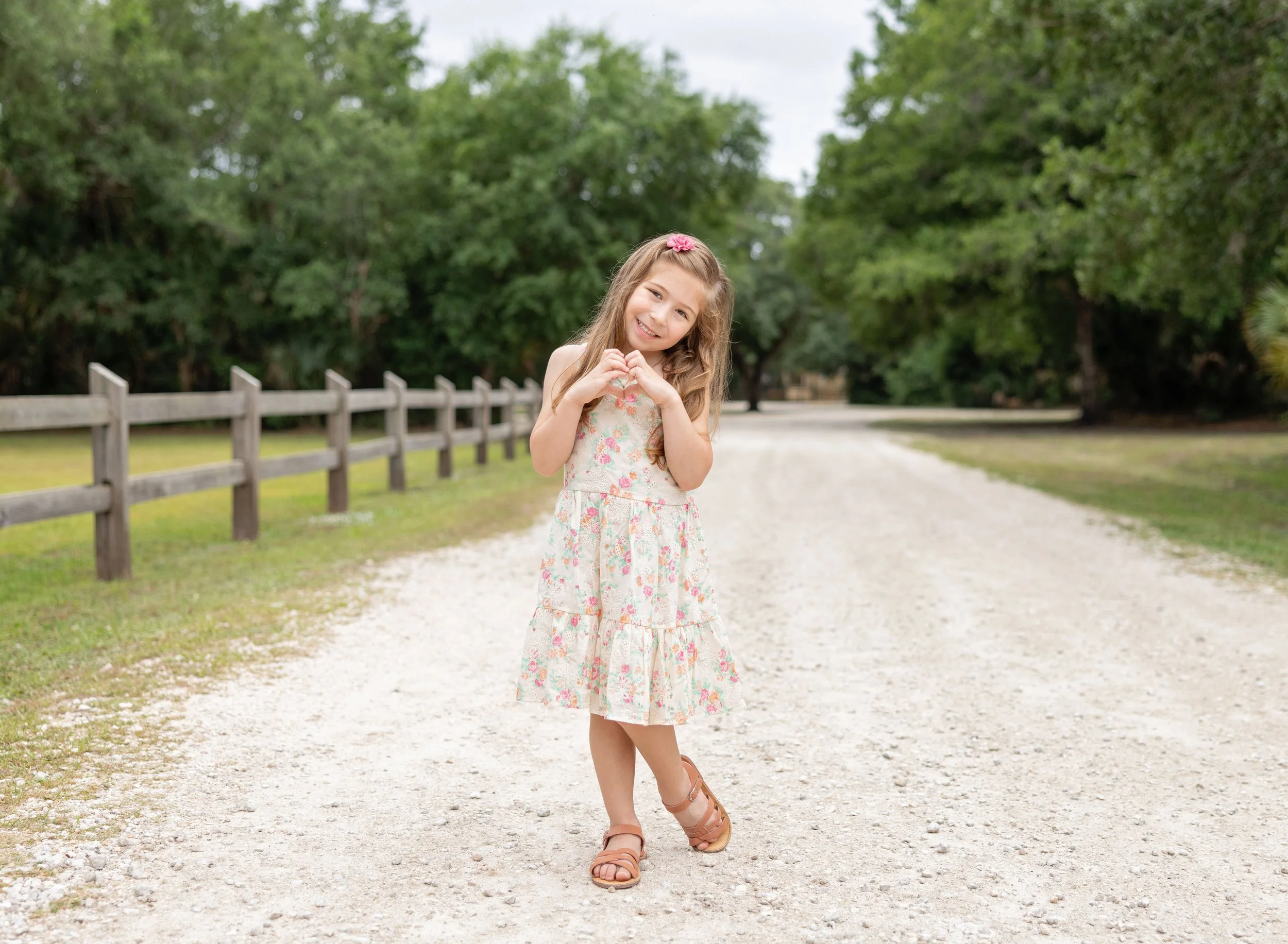 Five year old in park in floral dress in North Port FL