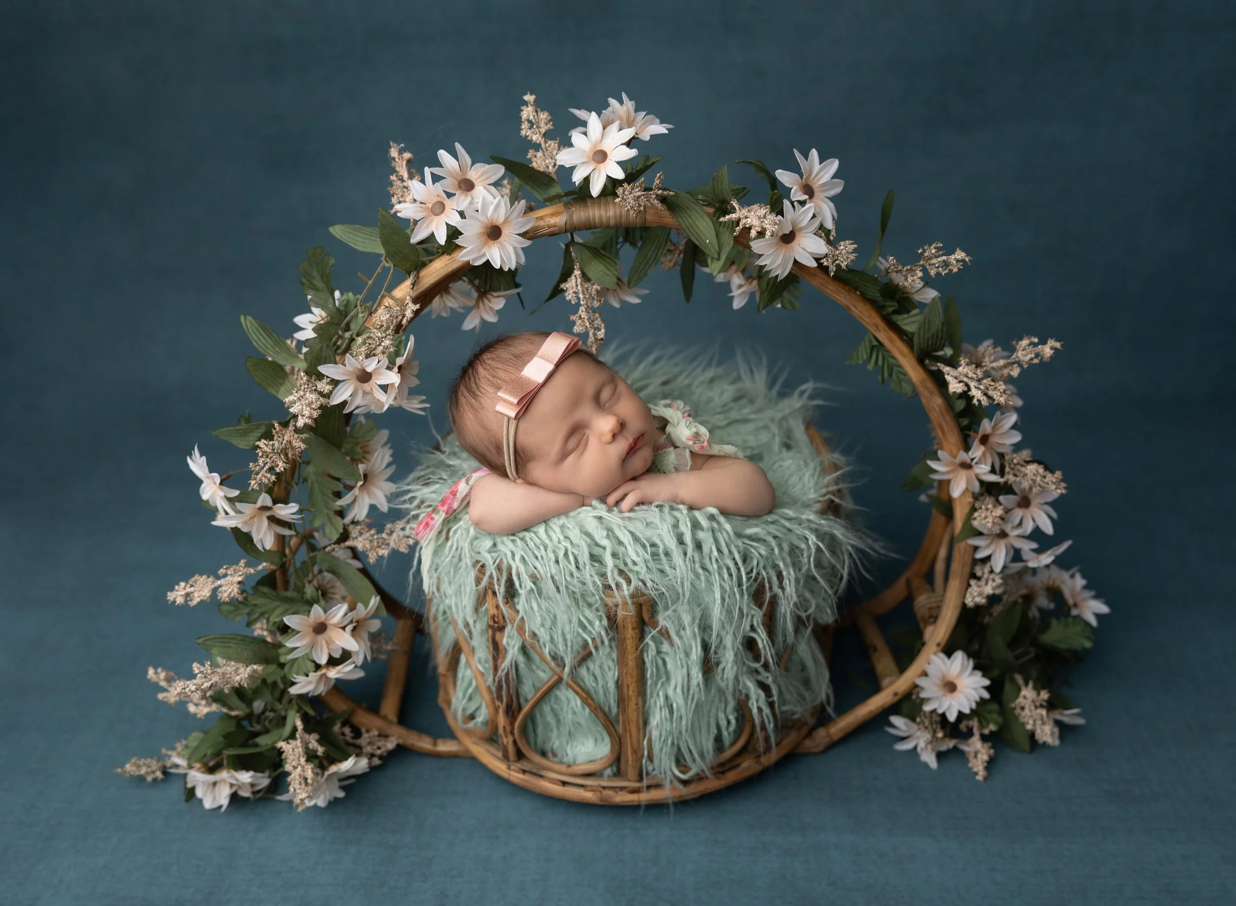 Newborn girl in green with flowers Venice FL