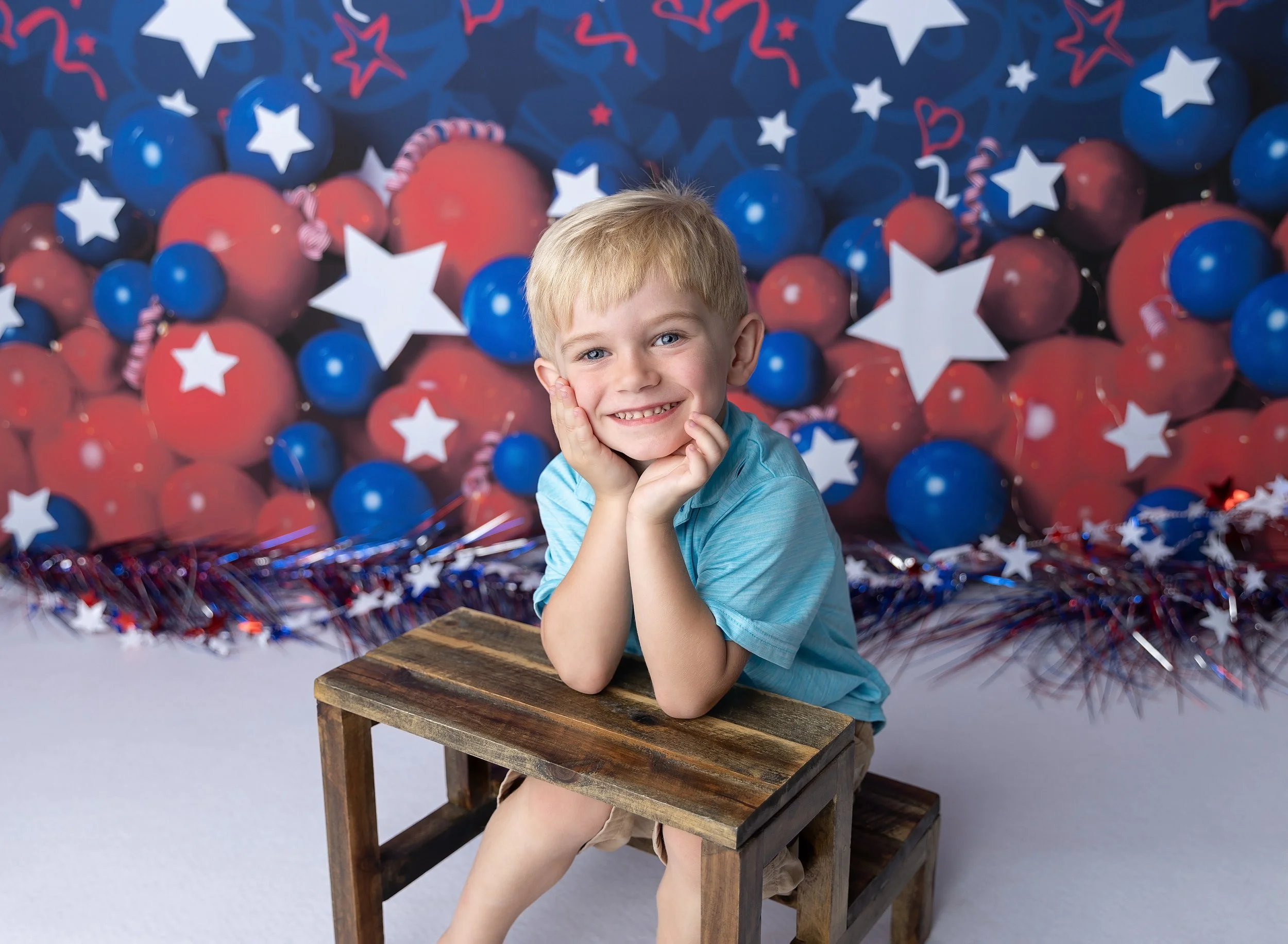 Four year old boy on July 4 themed backdrop in Fort Myers Fl photo studio