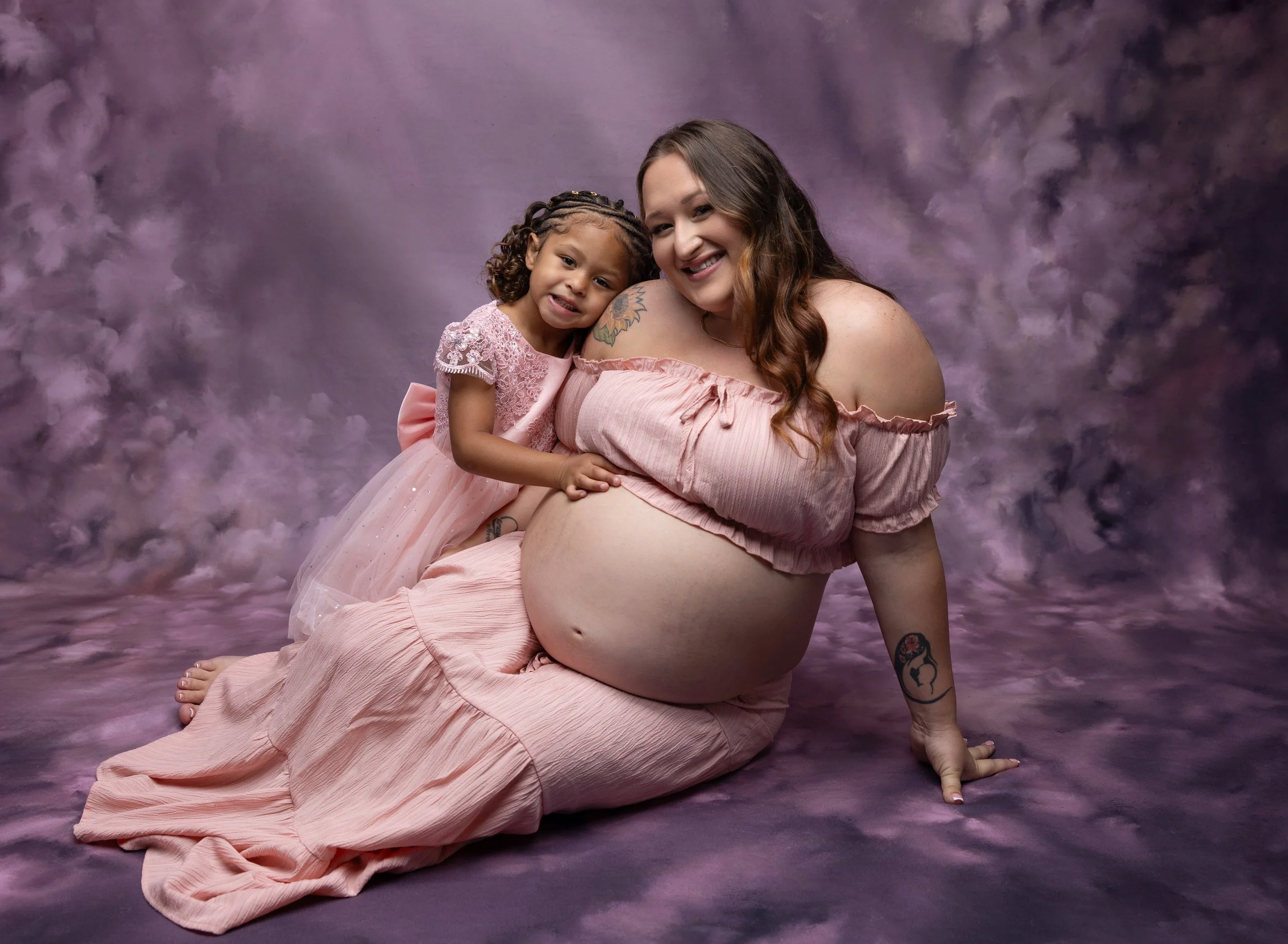 Pregnant mom in pink gown with daughter in North Port Fl photo studio