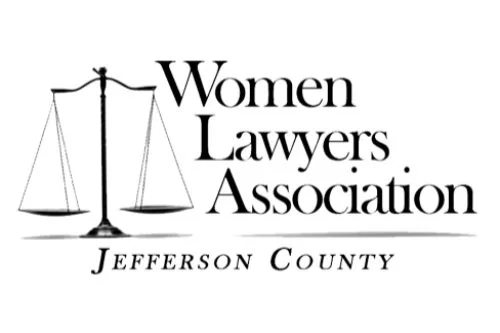 Logo of Women Lawyers Association of Jefferson County featuring a balance scale and text.