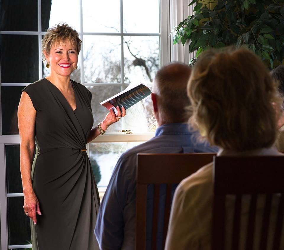 Dr. Jan Anderson presenting to a room of professionals