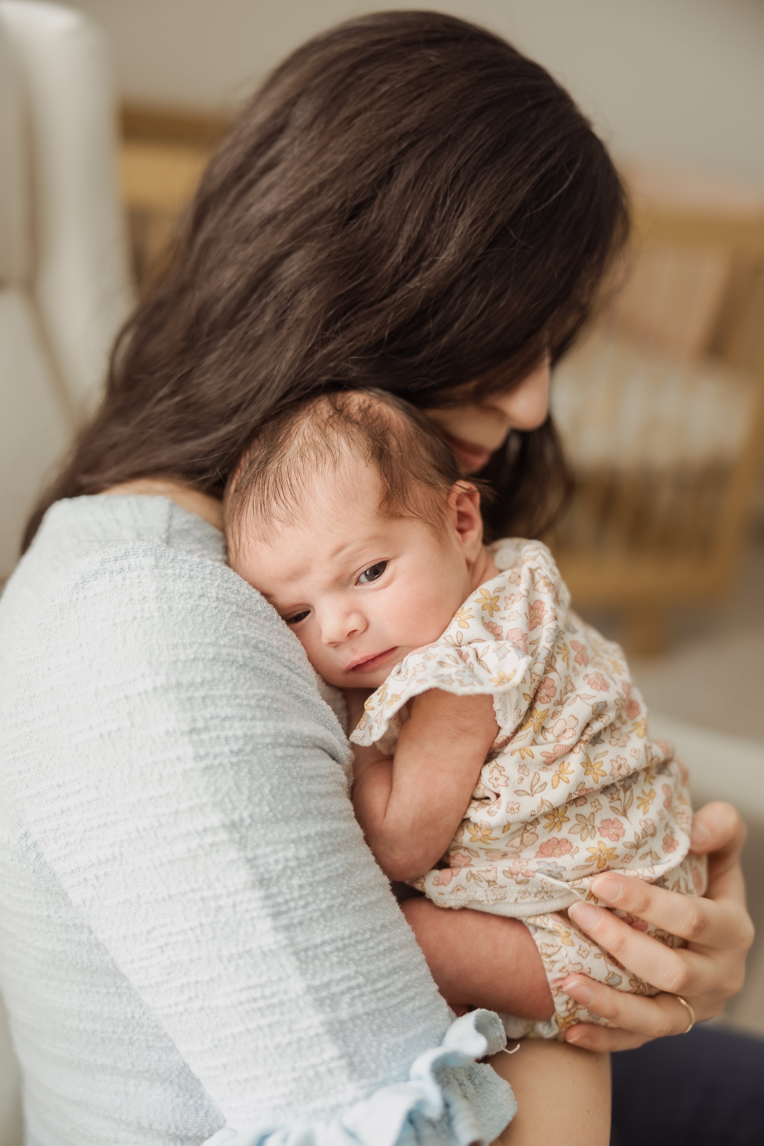  Plaistow NH mom soothing newborn during in-home photography session. 