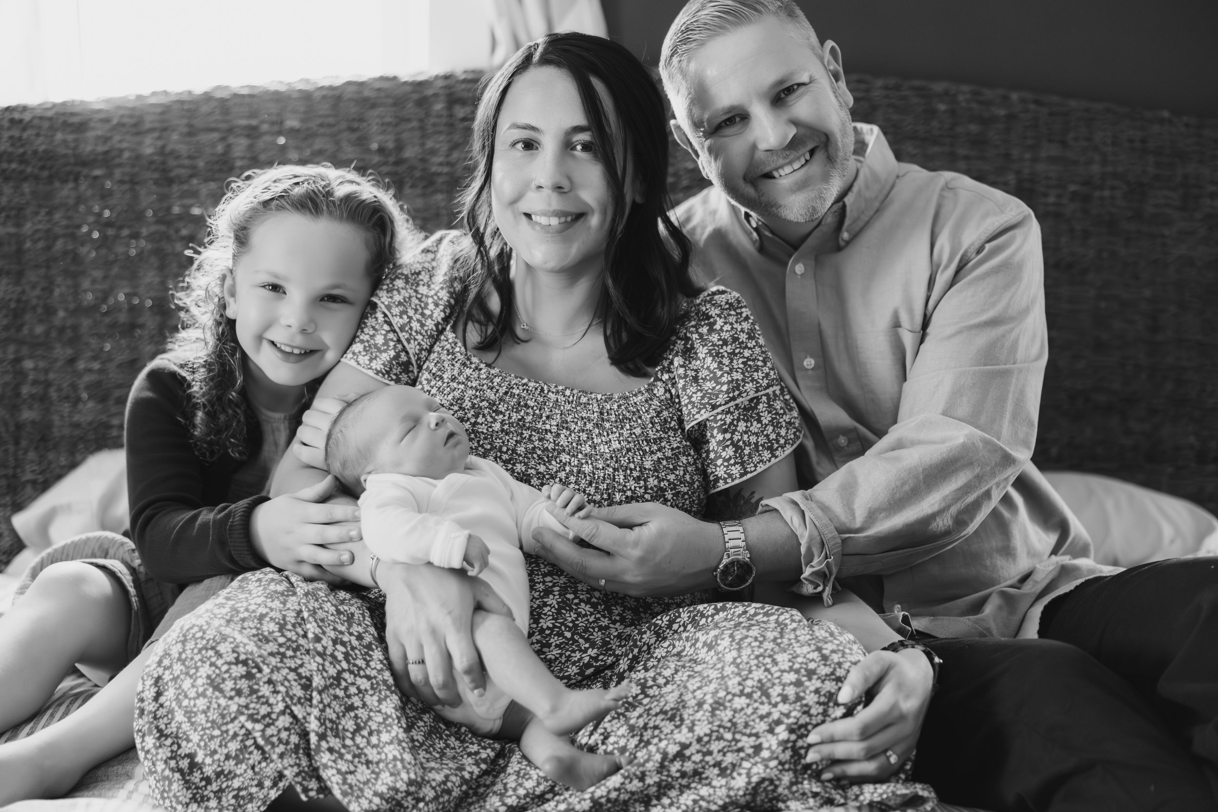 Lifestyle in-home newborn family photo in Northern Massachusetts showing authentic connection