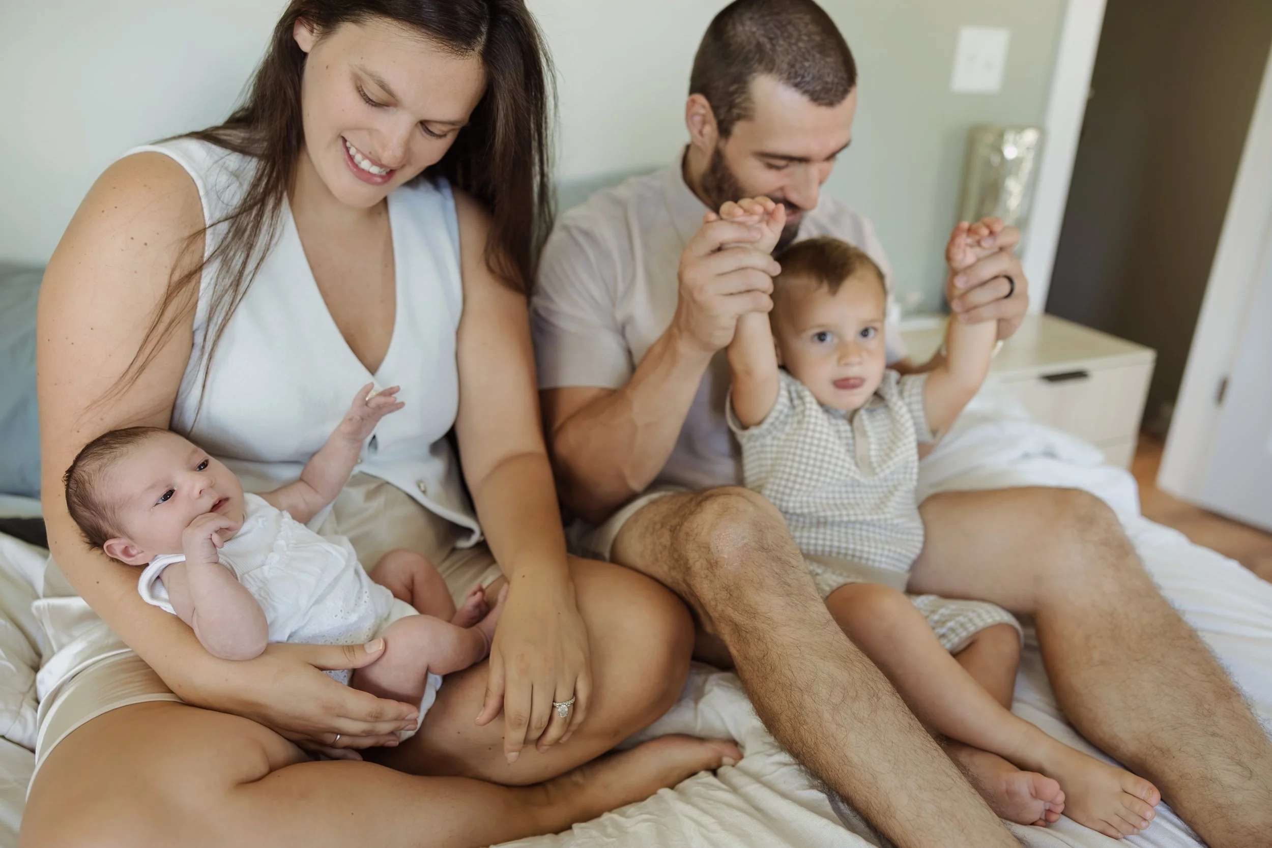 Southern New Hampshire lifestyle newborn photographer captures authentic in-home family session