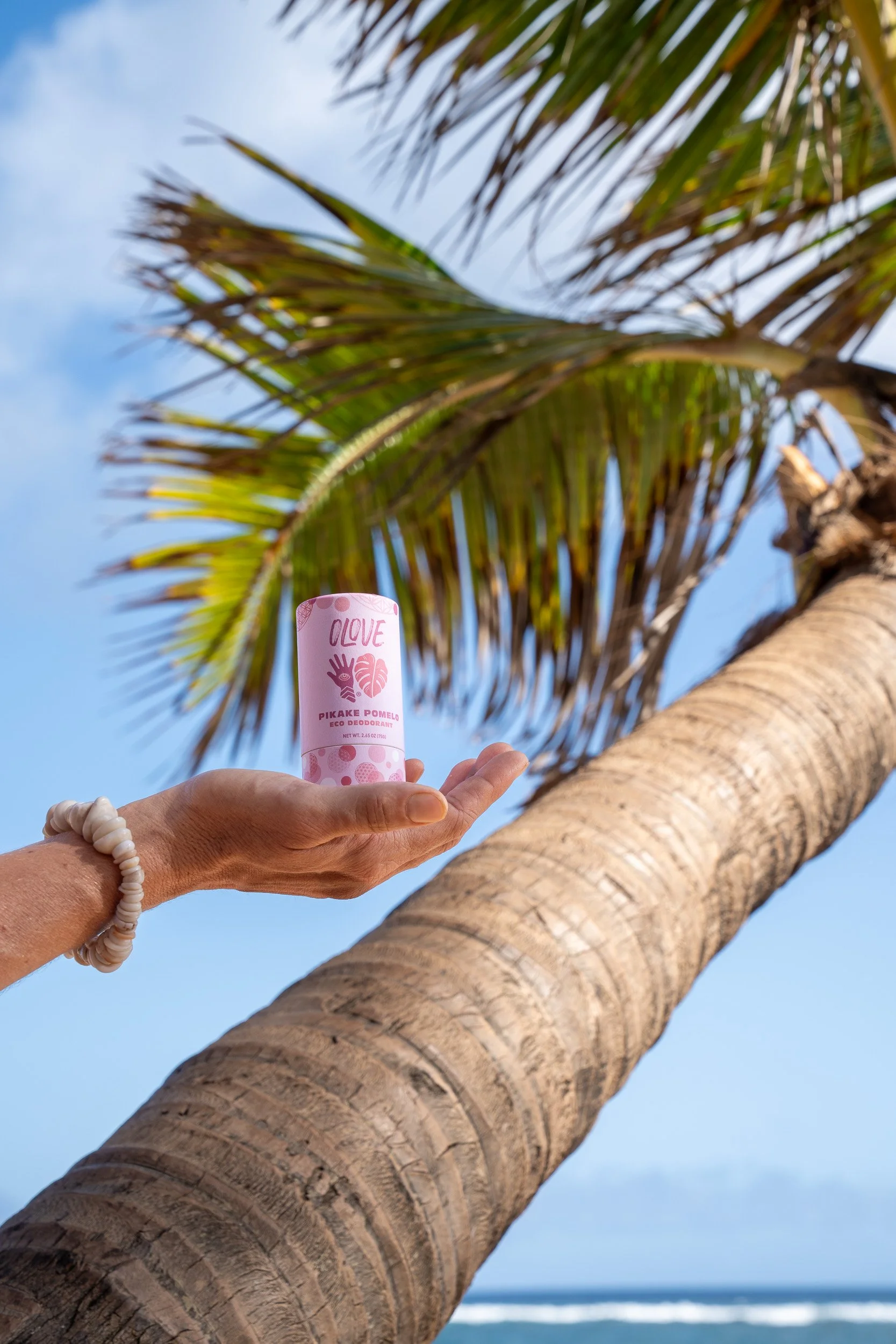 olove-natural-skincare-product-shoot-deodorant-hero-palm-tree-ocean-ashgerlcreative-20.jpg