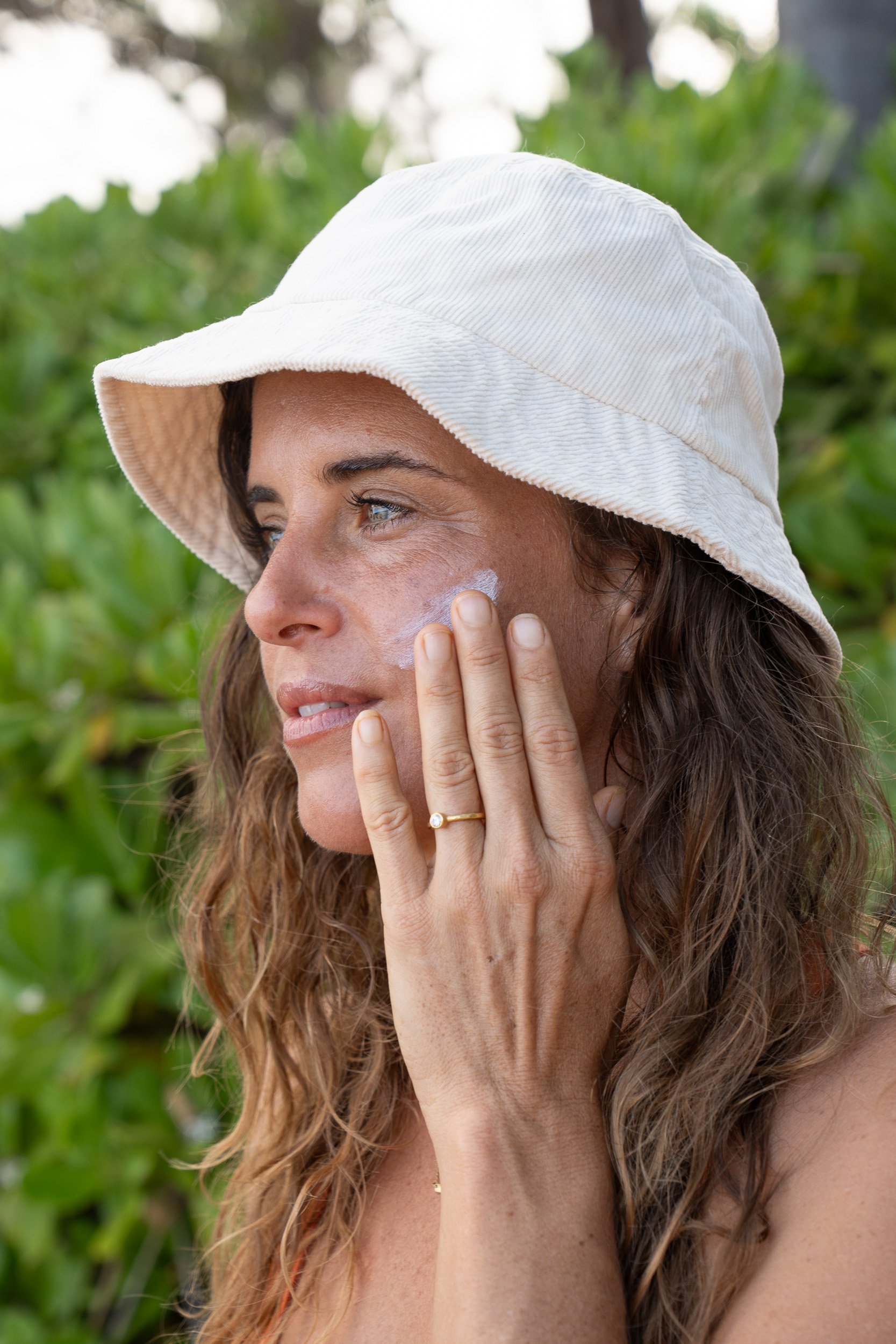 olove-natural-skincare-product-shoot-face-sunscreen-portrait-bucket-hat-ashgerlcreative-10.jpg