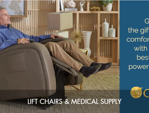 An elderly man sitting comfortably in a recliner chair in a modern living room with wooden shelves and decorative items.