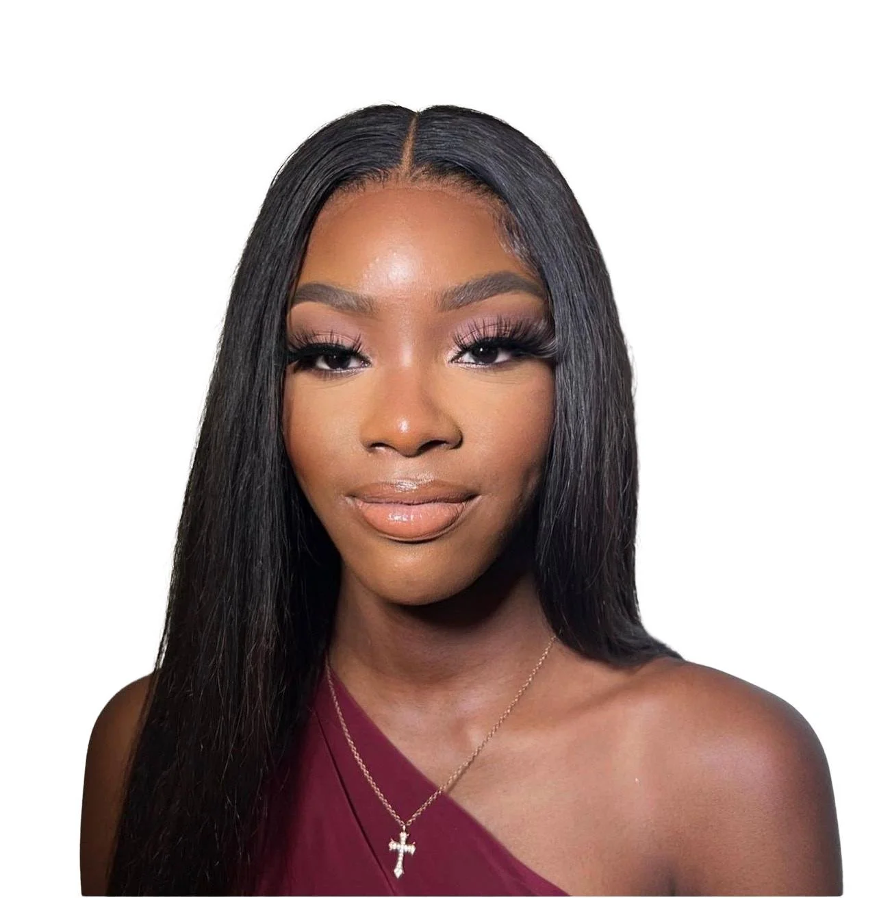 Portrait of a woman with long black hair, wearing makeup and a maroon top, accessorized with a necklace featuring a cross pendant.