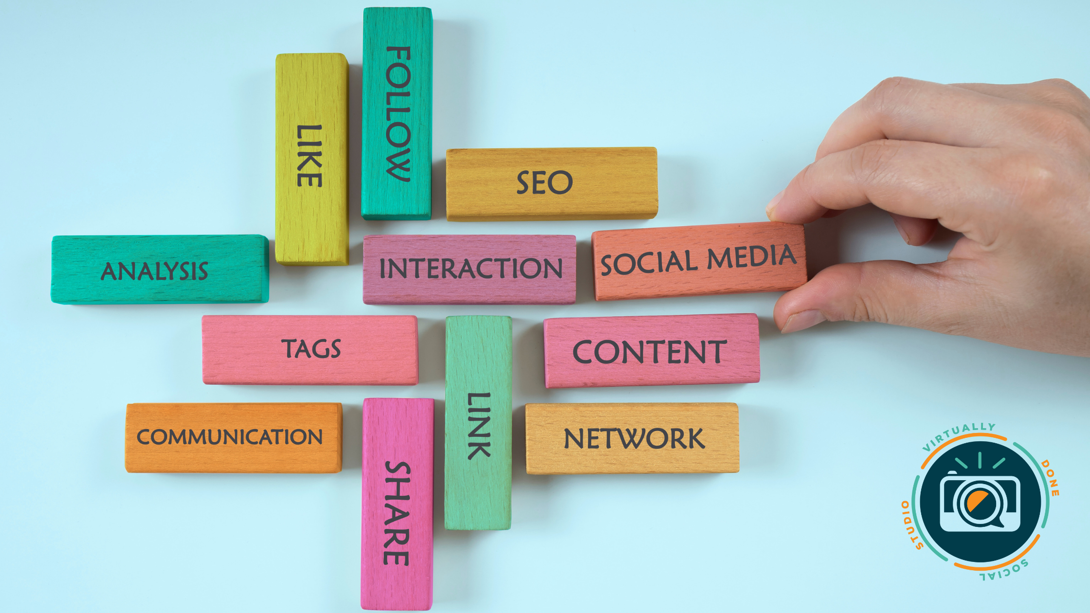 Social media strategy keywords on colorful blocks, representing content, SEO, tags and communication for small businesses.
