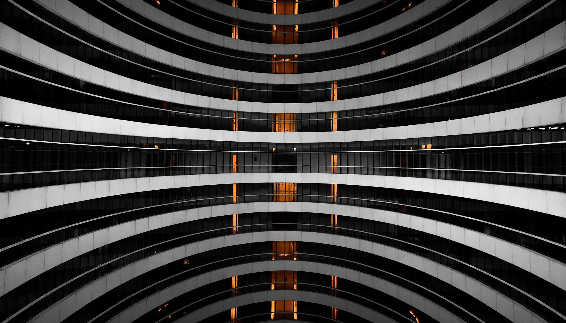 Curved architectural facade illustrating structured BIM systems, coordinated workflows, and repeatable design logic at scale.