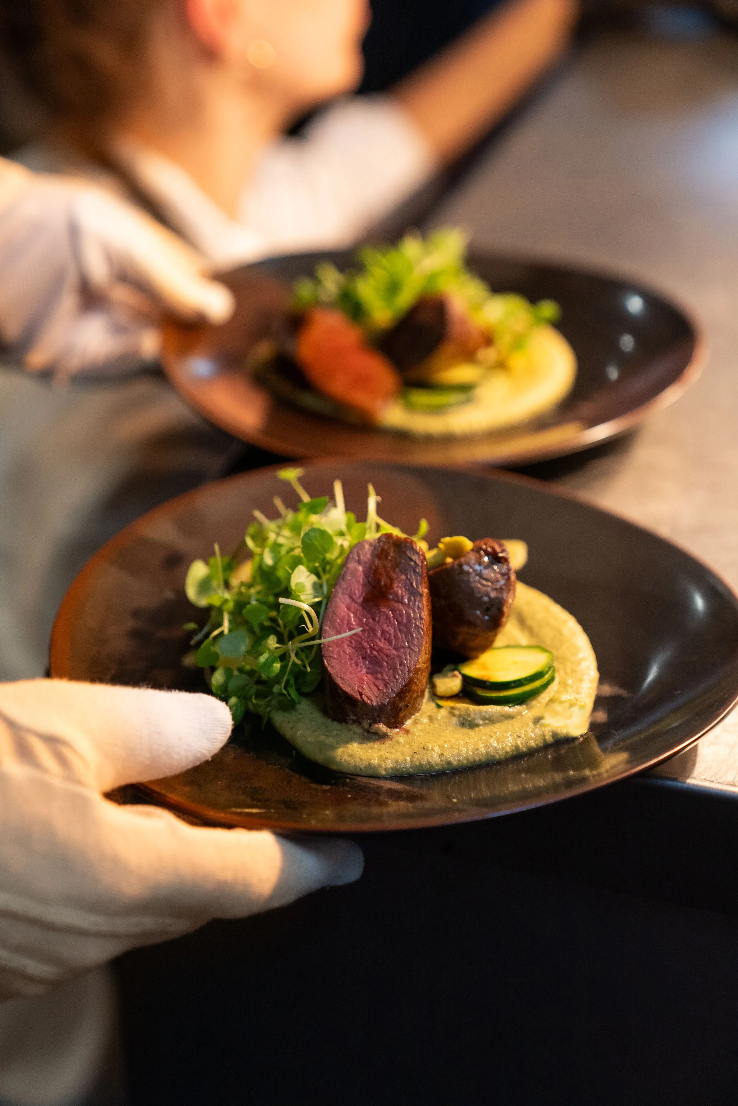 Main course being served to guests at their event