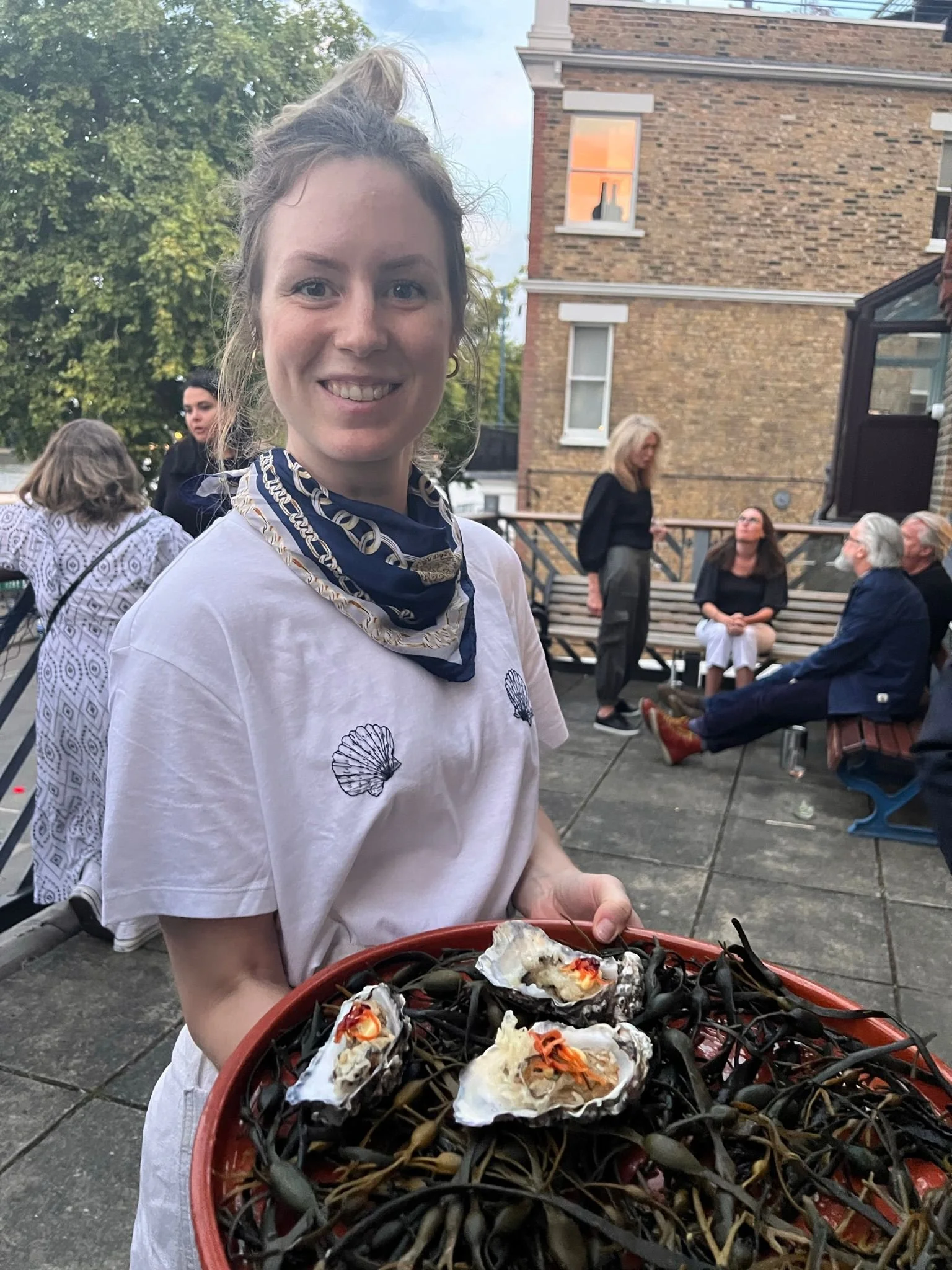 Fresh oysters being served by one of the Dinner Ladies team