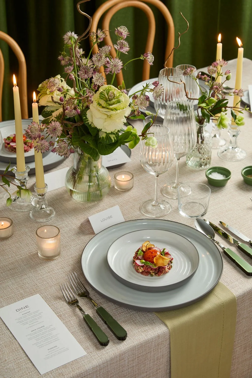 Delicious starter presented on luxury table setting in greens and whites