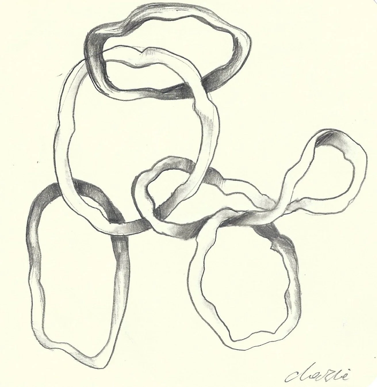 A black and white sketch of interconnected loops and circles with a signature at the bottom right.