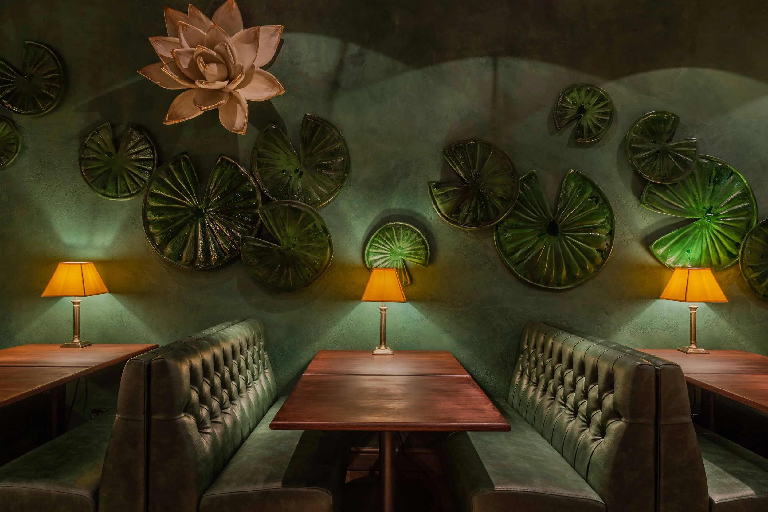 Dark-walled dining room with plush banquettes at Ayllu restaurant, Paddington