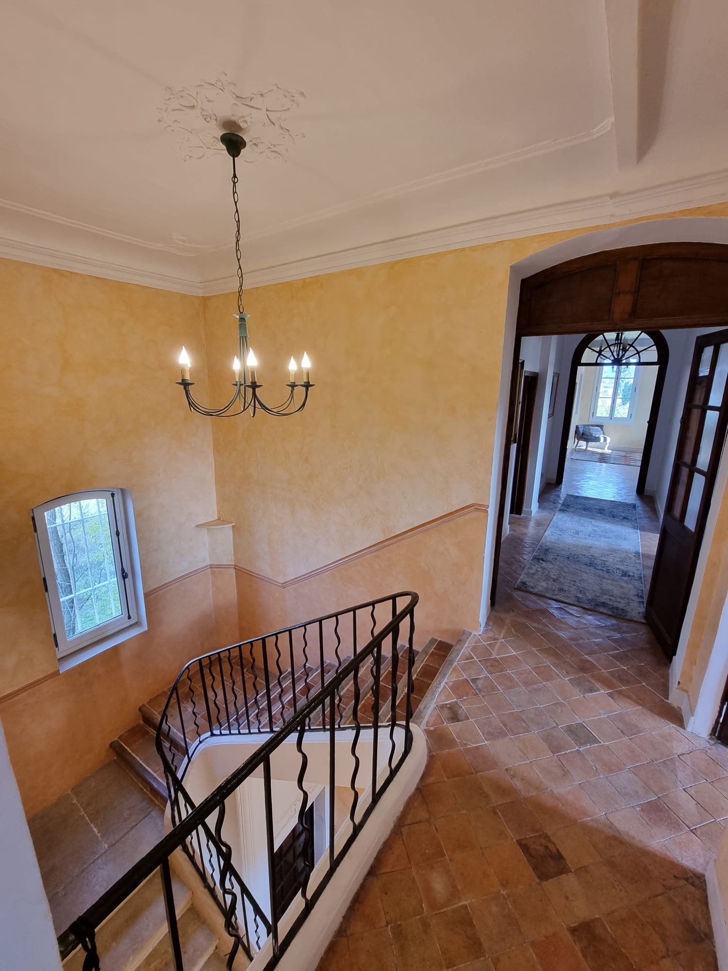 Top of staircase and hallway to 3 of the rooms
