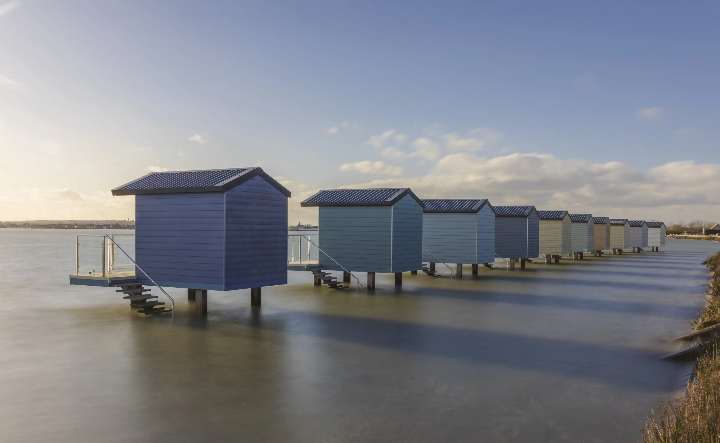Sunset Osea Beach huts.jpg
