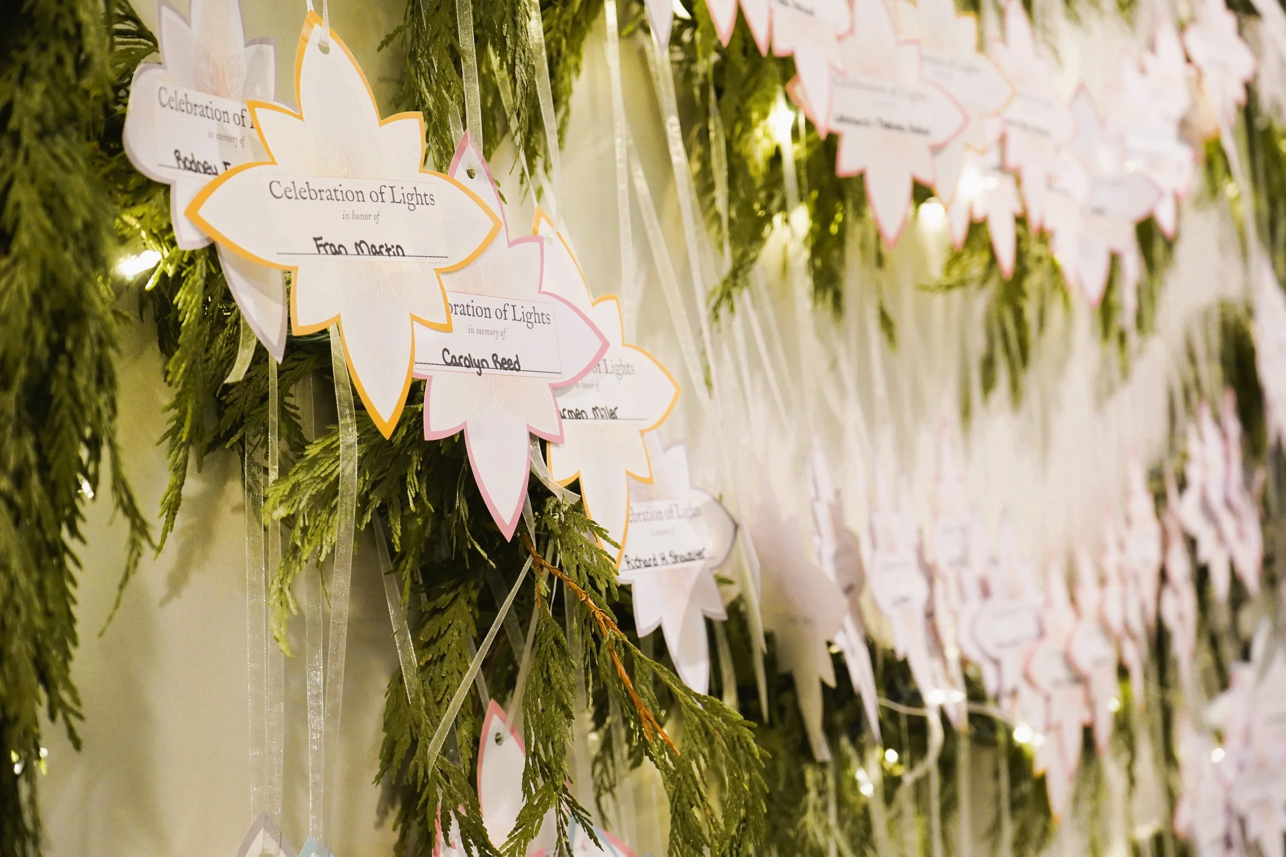 paper decorations lining the wall with greenery